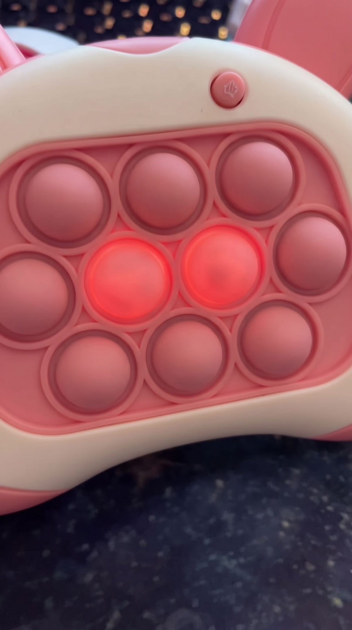 Close-up of lit bubbles on the pink bunny push game
